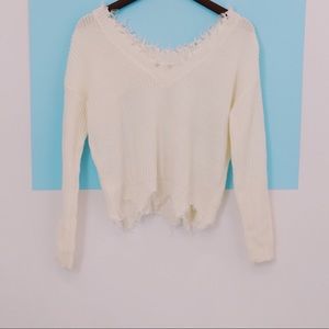 Raw hem distressed sweater